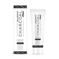A side-by-side view of the tube and box for Maxdent Complete Care Charcoal Toothpaste. The clean white and black packaging highlights a formula of activated charcoal and natural oils, specifically spearmint and wintergreen. A prominent badge indicates that more than 95% of the ingredients are of natural origin. Supplied by sustainable UK oral care retailer, Edinco.