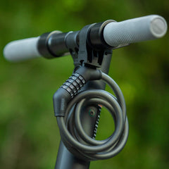 Edinco bike and scooter lock with combination dial attached to a scooter handlebar