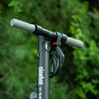 Edinco bike and scooter lock securely mounted on a Ninebot scooter handlebar outdoors