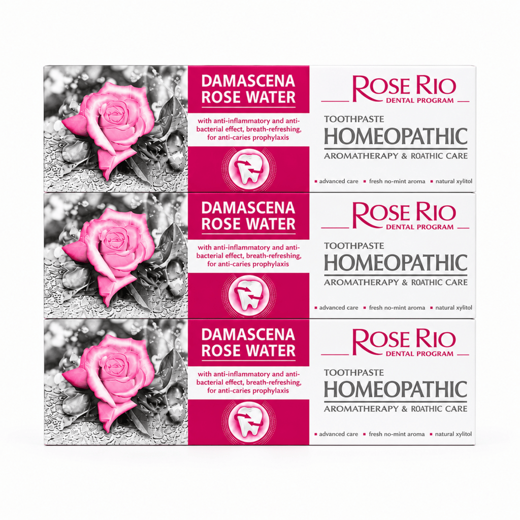 A triple pack bundle consisting of three identical boxes of Rose Rio Homeopathic Toothpaste in the Damascena Rose Water variant, stacked vertically against a clean white background. The bright pink and white packaging highlights key oral care benefits: anti-inflammatory protection, anti-bacterial effects, breath refreshing, and anti-caries prophylaxis. Text confirms the formula includes natural xylitol and a fresh no-mint aroma for advanced homeopathic oral care. Distributed by Edinco, UK.