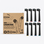 Edinco 8-pack of black charcoal toothbrush heads compatible with Oral-B electric toothbrushes, displayed next to plastic-free, recyclable kraft paper packaging with FDA and TÜV trust certifications.