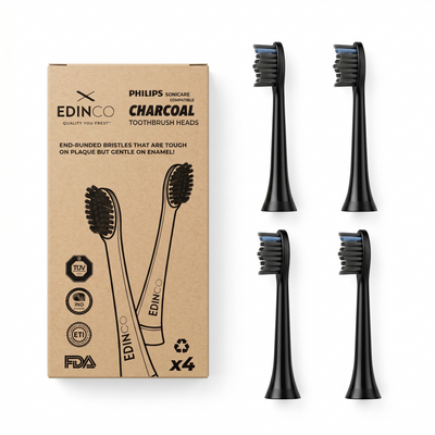 Edinco recyclable charcoal toothbrush heads compatible with Philips Sonicare, shown unboxed next to the eco-friendly brown packaging x4 pack.`